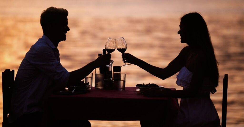A happy couple enjoying a dinner date.