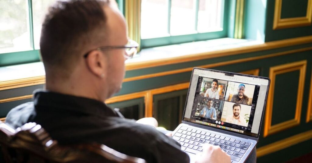 Dr. Mike is speaking to a group of men virtually on a video conference.
