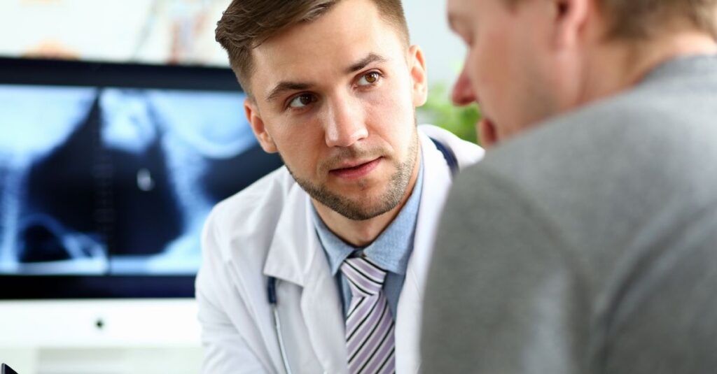 Man talks to his doctor.
