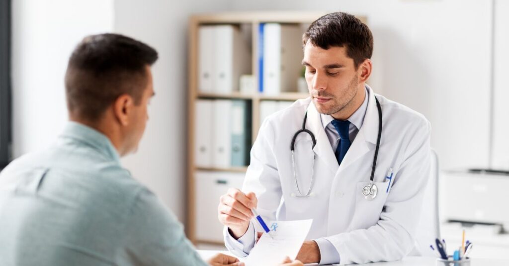 A doctor talks to his male patient.