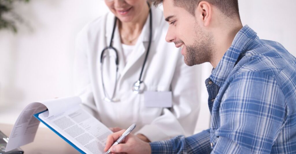 Man talks to his doctor.