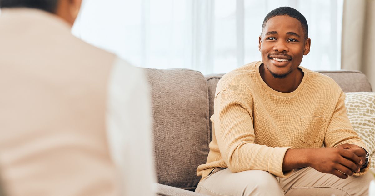 A man speaks with a therapist in a private counseling session.