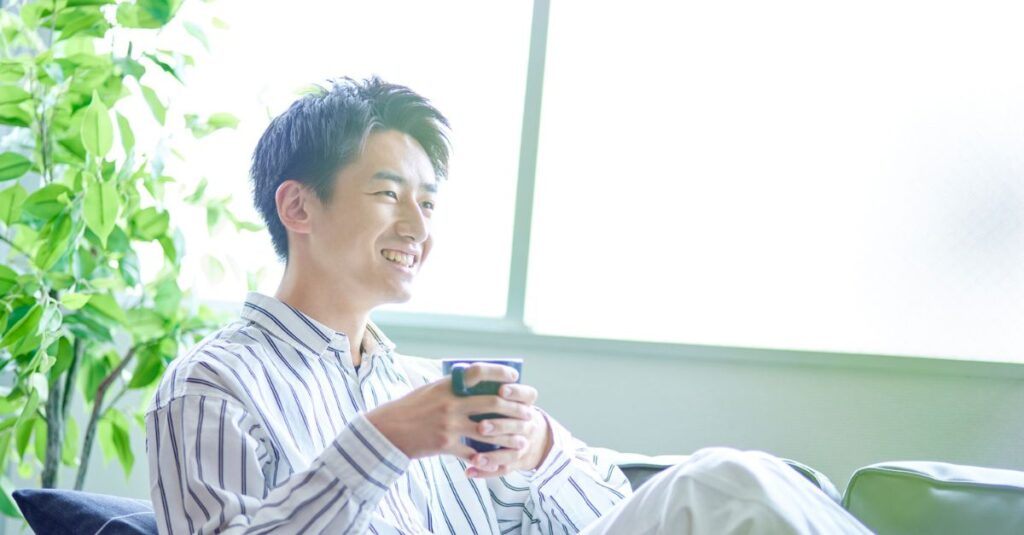 A relaxed middle-aged man smiling softly, symbolizing renewed confidence and healthy sexual well-being.