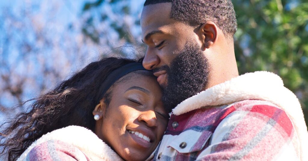 Couple rebuilding intimate connection with a hug.