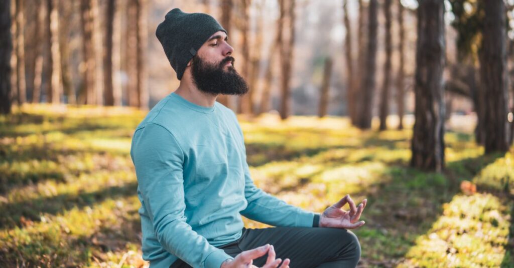 Man practicing mindfulness and body awareness to reset.