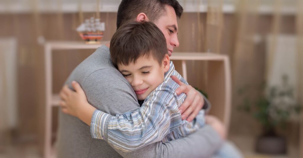 Father hugs young son