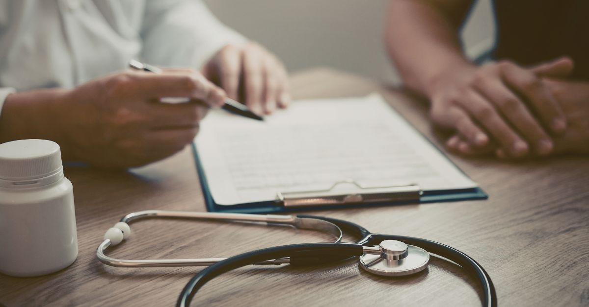 Man consulting with doctor